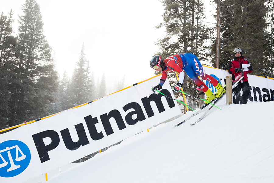A skier blasts out of the starting gate, but is it a NASTAR or Masters race? Answer: NASTAR (credit: Dave Camera/NASTAR).