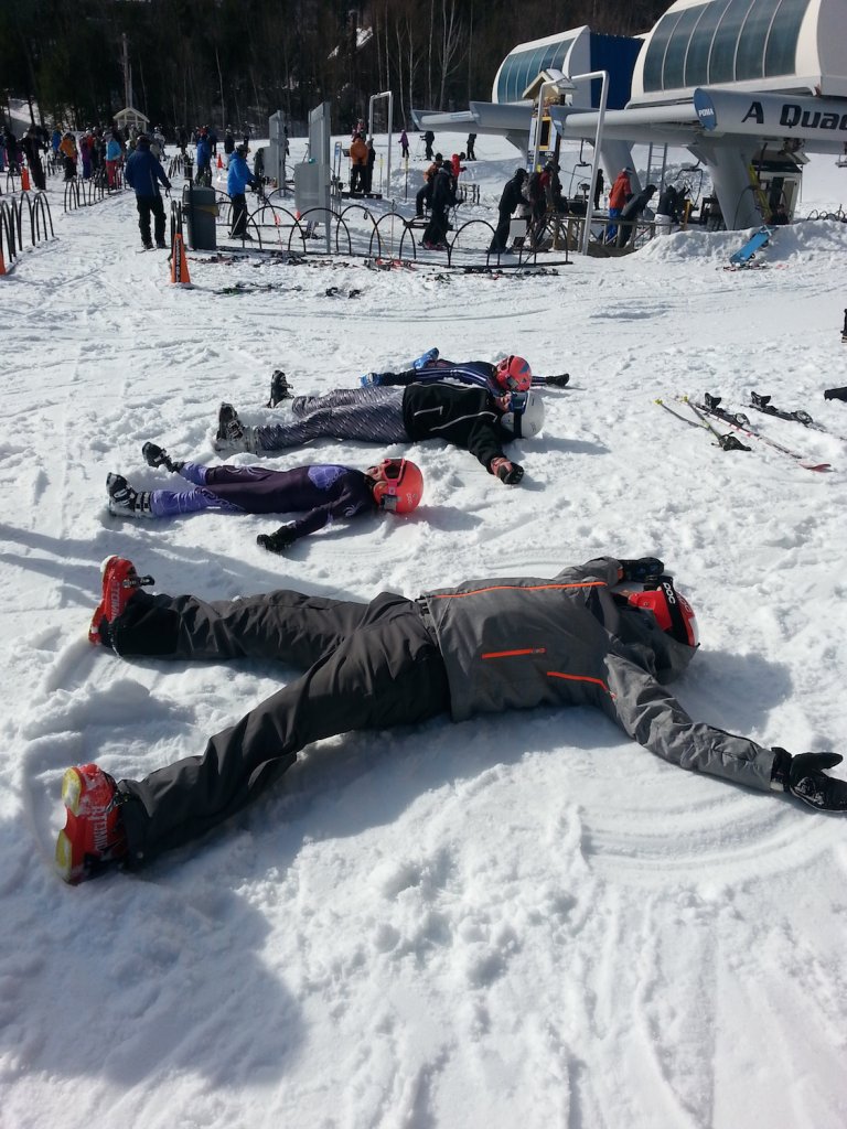 Marco is not above getting down with the kids and making snow angels